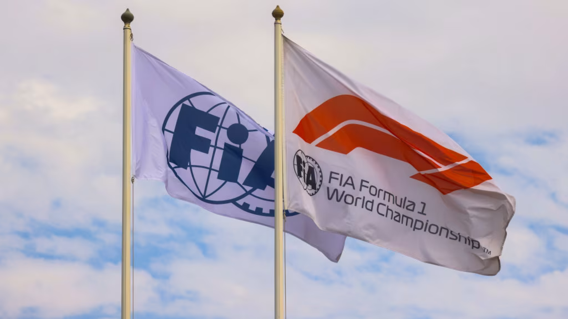 FIA and Formula 1 flags regarding the topic of F1 points system change.
