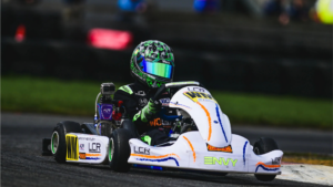 Young karting driver racing a competition kart on track, illustrating the first step in the journey to becoming a Formula 1 driver