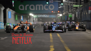 Formula 1 cars racing under floodlights during a night Grand Prix, featured in Netflix’s Drive to Survive series