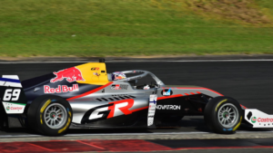 Red Bull– and Toyota-backed single-seater race car on track, featuring Kalle Rovanperä branding during a circuit test.