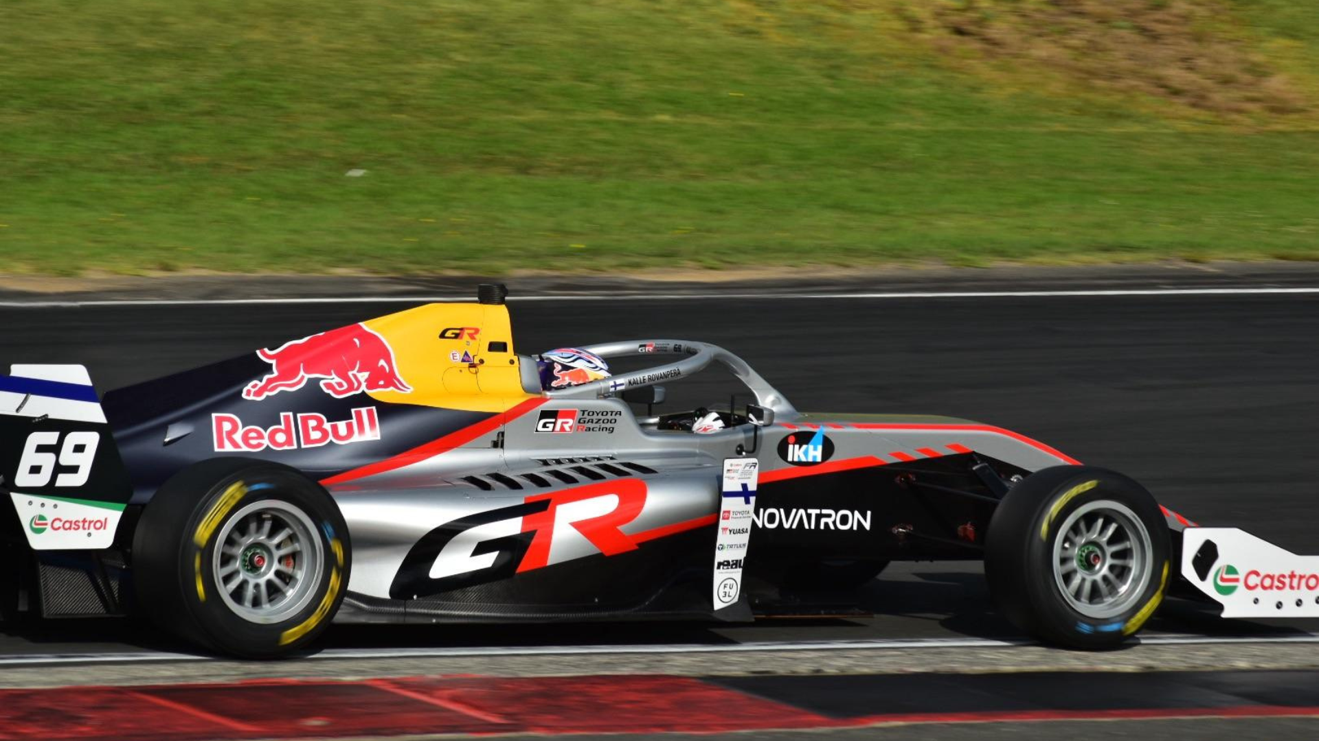 Red Bull– and Toyota-backed single-seater race car on track, featuring Kalle Rovanperä branding during a circuit test.