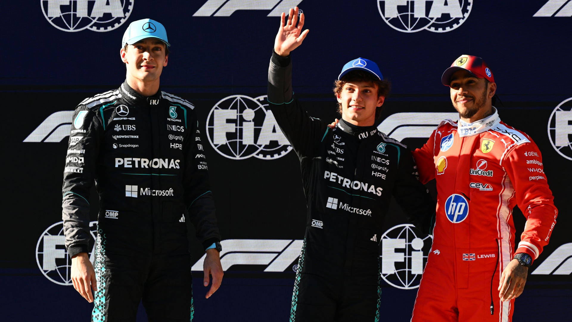 Kimi Antonelli celebrates his first Formula 1 victory at the 2026 Chinese Grand Prix podium with George Russell and Lewis Hamilton