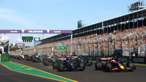 Australian Grand Prix at Albert Park in Melbourne with Formula 1 cars racing past packed grandstands and Winners List 1985–2026 title overlay